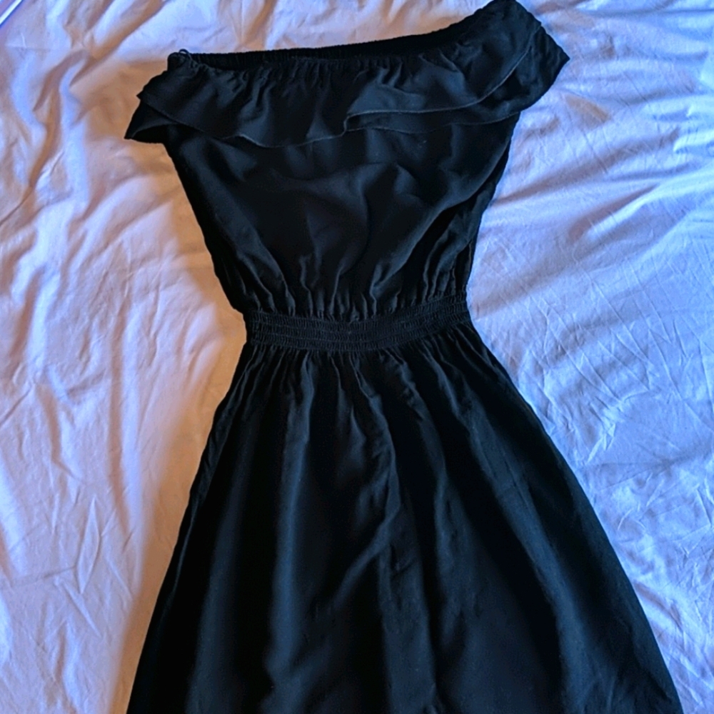 Strapless black mini dress.